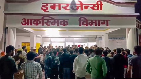 People gather outside Maharani Laxmi Bai Medical College