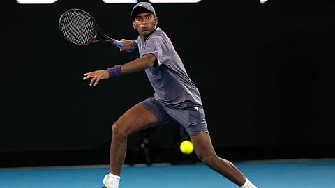 Nishesh Basavareddy plays a forehand return to Novak Djokovic of Serbia during their first round match at the Australian Open tennis championship in Melbourne, Australia, Monday, January 13, 2025.