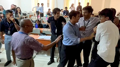 Christ University students catch their teacher off guard with a fake fight and heartfelt goodbye