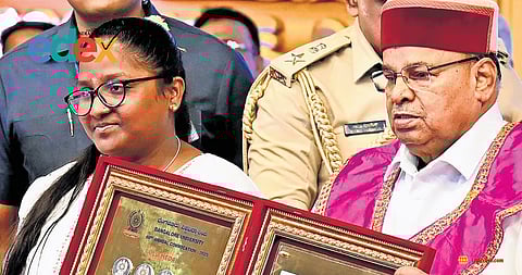 Prema S receives 11 gold medals in MA Kannada from Governor Thaawarchand Gehlot at the Bangalore University Convocation