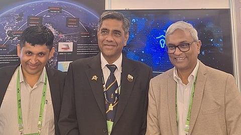Dr Ajith Padyana, Dr Cdr Devendra Singh and Sunil Gupta during the VTU–QNu Labs partnership announcement at IMC 2025