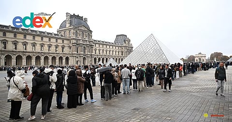 Soldiers patrol as people queue to try to enter the Louvre museum, although it remains closed for the day after Sunday's jewels robbery, Monday, Oct. 20, 2025 in Paris