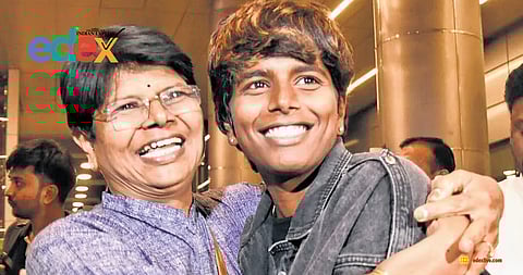 Arundhati Reddy from Hyderabad, a member of the World Cup winning Indian cricket team, hugs her mother upon arriving at Rajiv Gandhi International Airport on Thursday