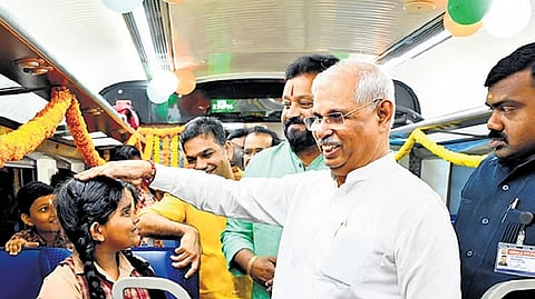Governor Rajendra Arlekar and Union Minister Suresh Gopi interact with students on board the Vande Bharat.