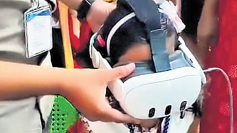 A student using a virtual reality headset at the anganwadi at Mezhuveli in Pathanamthitta