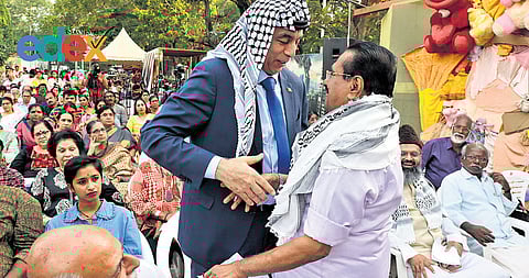 Writer George Onakkoor greets Palestinian Ambassador to India Abdullah Abu Shawesh during a Palestine solidarity meet at Manaveeyam Veedhi in Thiruvananthapuram on Sunday