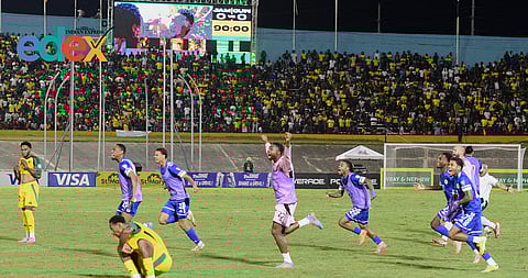 Curaçao players celebrate qualifying for the 2026 FIFA World Cup after a soccer match against Jamaica in Kingston, Jamaica, Tuesday, Nov. 18, 2025