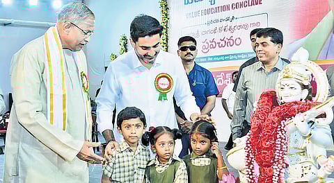 Education Minister Nara Lokesh and Advisor to Government of AP, Chaganti Koteswara Rao, at the Value Education Conclave at Tummalapalli Kalashetram in Vijayawada on Monday. HRD Minister Nara Lokesh is also seen Photo | Express