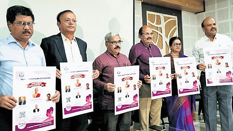 Andhra University Alumni Association office bearers releasing a poster of WAVES 2025 in Vizag