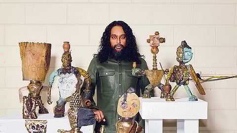Ramesh Mario Nithiyendran with his artworks