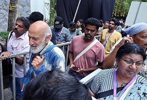 People waiting to watch movies at the 30th IFFK in Thiruvananthapuram, Tagore Theatre on Wednesday.