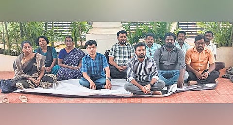 Teaching fellows working at Anna University’s Madurai regional centre staged a sit-in protest inside the campus on Thursday