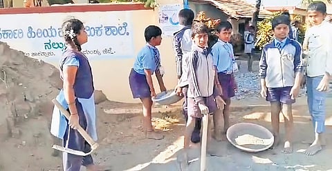 A video grab of children working at the Government Higher Primary School in Nelkundi village of Nagamangala taluk recently