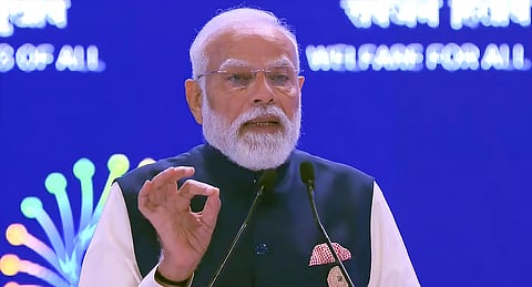 Prime Minister Narendra Modi addresses the gathering during the India AI Impact Summit 2026, in New Delhi, Feb. 19, 2026.