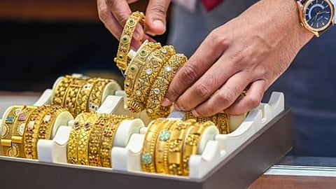 Gold slides 5.9% this week as dollar surge dents prices