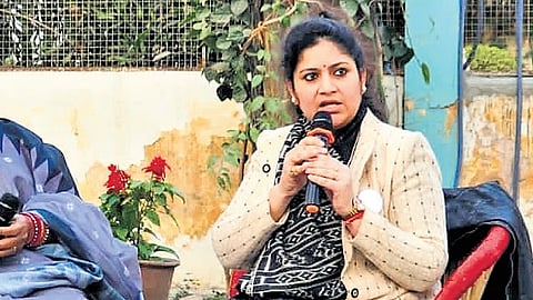Professor-turned-transgender rights activist Preeti Choudhary (L) speaks at an event.