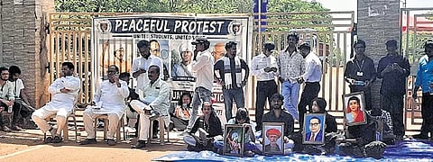 Students staging protest in front of the university gate on Wednesday