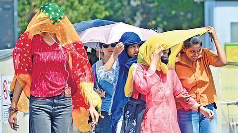 Women braving heat in Delhi as the temperature touches 42 degrees Celsius.