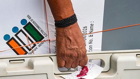 A polling official carries sealed election materials on the eve of voting in the second phase of the West Bengal Assembly elections, in Kolkata, Tuesday, April 28, 2026