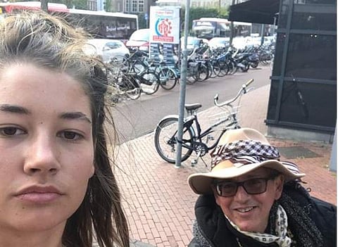 20-year-old Noa Jansma taking a selfie with one of her catcallers