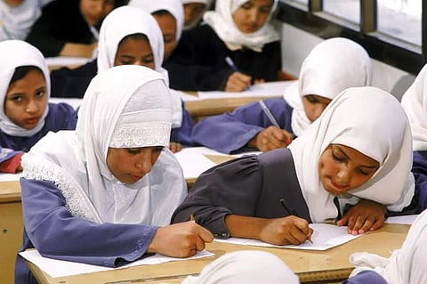 American teacher who ripped off student's hijab in school got immediately fired