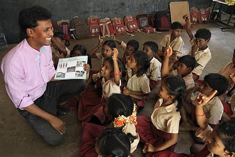Arockiaraj is super-animated when he spends time teaching his children at Konerikuppam | Pics: G Pattabi Raman