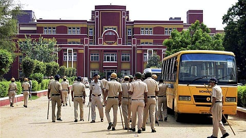 Cops after the murder scene at Ryan International on Friday