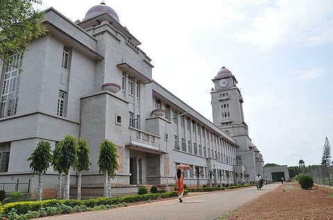 The report states that Karnataka University in Dharwad and Mangalore University in Mangalore have the highest number of study centres