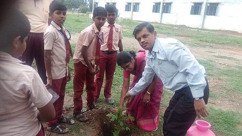 Eswaran with his students during a plantation drive
