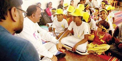 A corporator with children at the Grama Sabha (pic:newindianexpress.com)