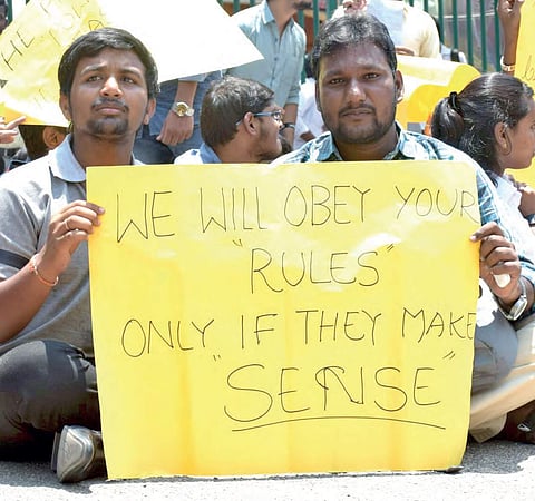NITHM students protesting against the college management for allegedly changing marking pattern third time in a week, in Hyderabad on Thursday | Express photo