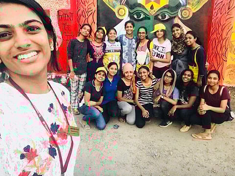 Team chayam's selfie with the graffiti