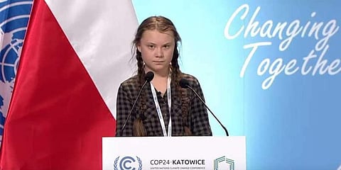 Greta Thunberg addressing a conference