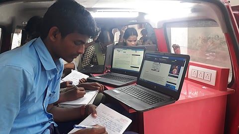 A boy from a government school takes notes during computer classes (Pic: Edimpact)