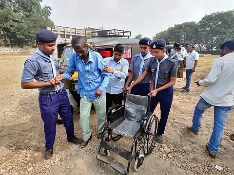Scouts and Guides students providing a wheel chair for senior citizen in the election booth (Pics: Express)
