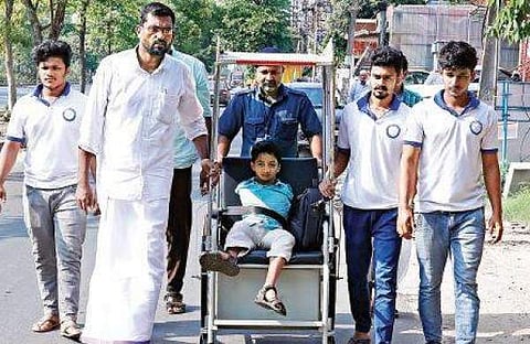 12-year-old Mohammed Asim undertook a 24-day-long 'yatra' on a wheelchair to protest against Kerala government (Pic: Express)