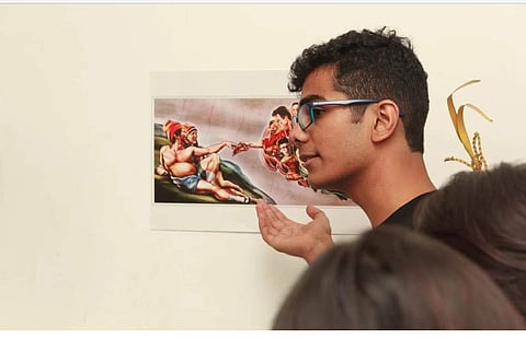 Anuj Nakade, Founder of an exhibition called Meme Regime explaining about memes to people