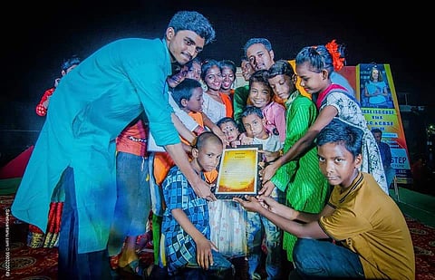 Pathikrit with the children that he teach