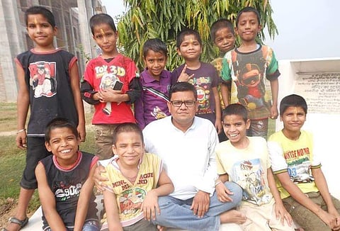 Ajay Sharma with the kids from the home