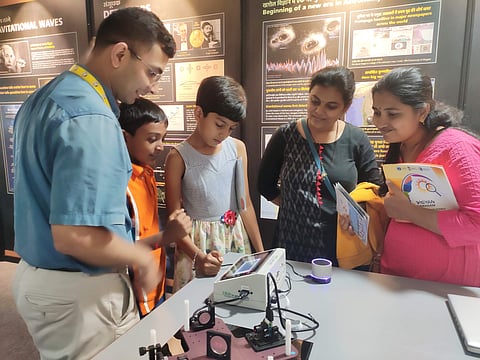 Visitors observe the gravitational waves in a device