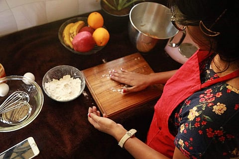 Kay Roberts in the process of baking