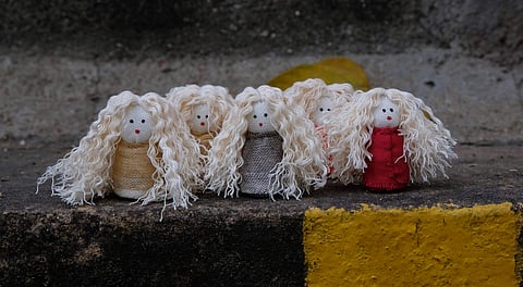 Curly hair dolls created by Premnath and Anisha