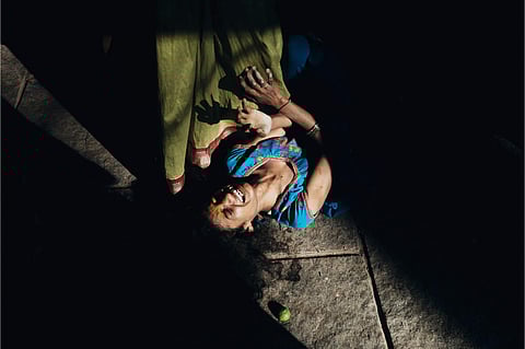 This is after a ritual which is done to get blessed with kids. The women stick to the outer walls of the temple and pray. This is an effect of hysteria during the process | (Pic: Vinod Venkapalli)