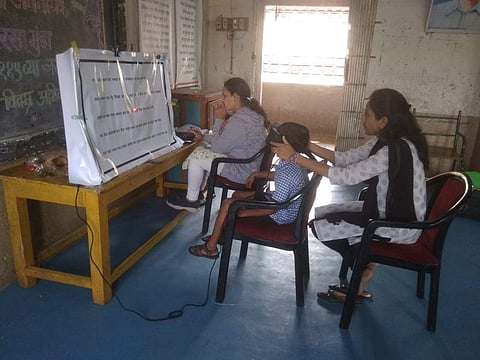A child being screened to check his reading ability