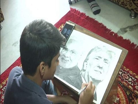 Mahir sketching the image