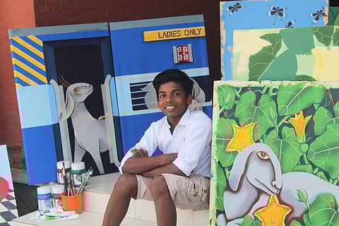 Anujath with his painting series My Goats, Their Lives
