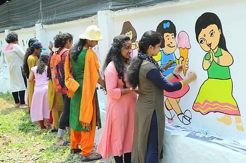 The students creating the cartoons