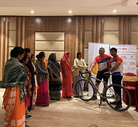 Chris speaking to widows | (Pic: The Loomba Foundation)
