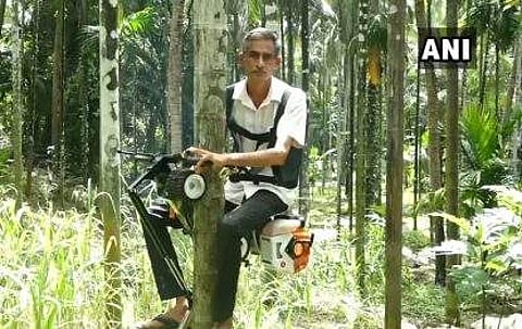 Bhat on the Areca nut bike