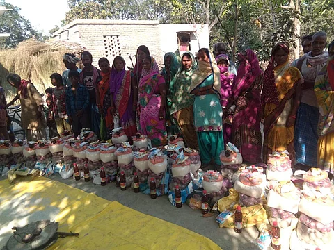 Women standing next to the supplied that the BAPSA handed to them